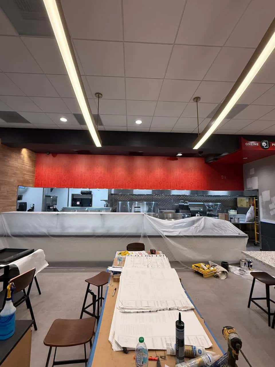 Restaurant dining room part way through a wallcovering installation