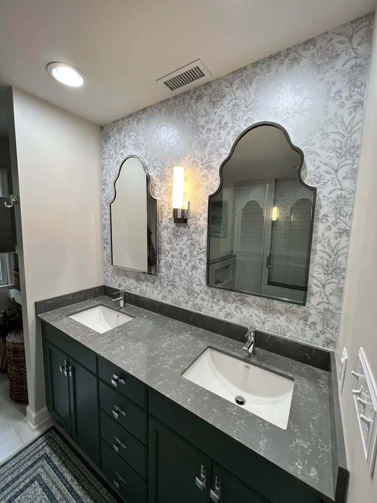 Marble-effect wallcovering in a bathroom with double vanity