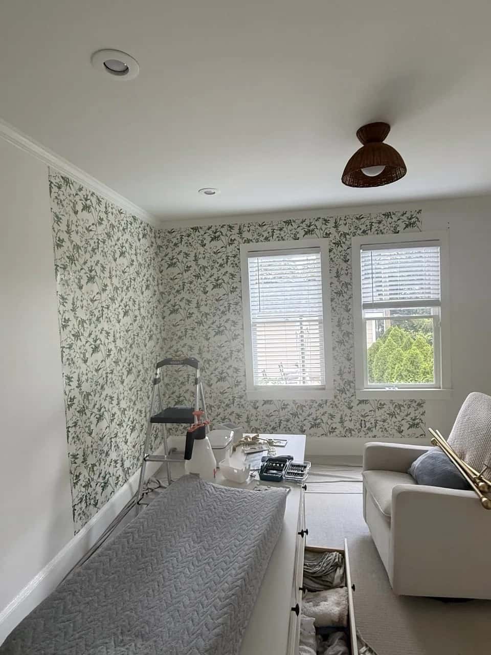 Botanical wallpaper along a hallway and stairs