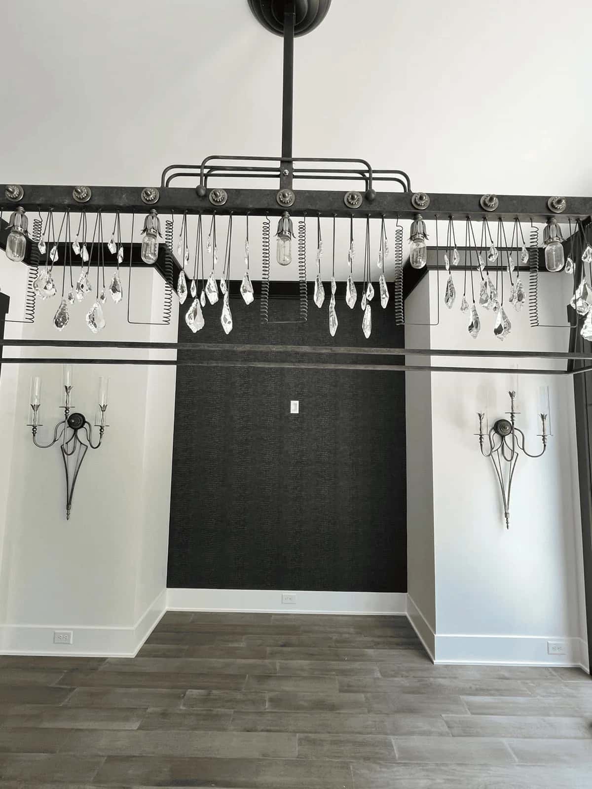 Black patterned wallpaper in a walk-in closet