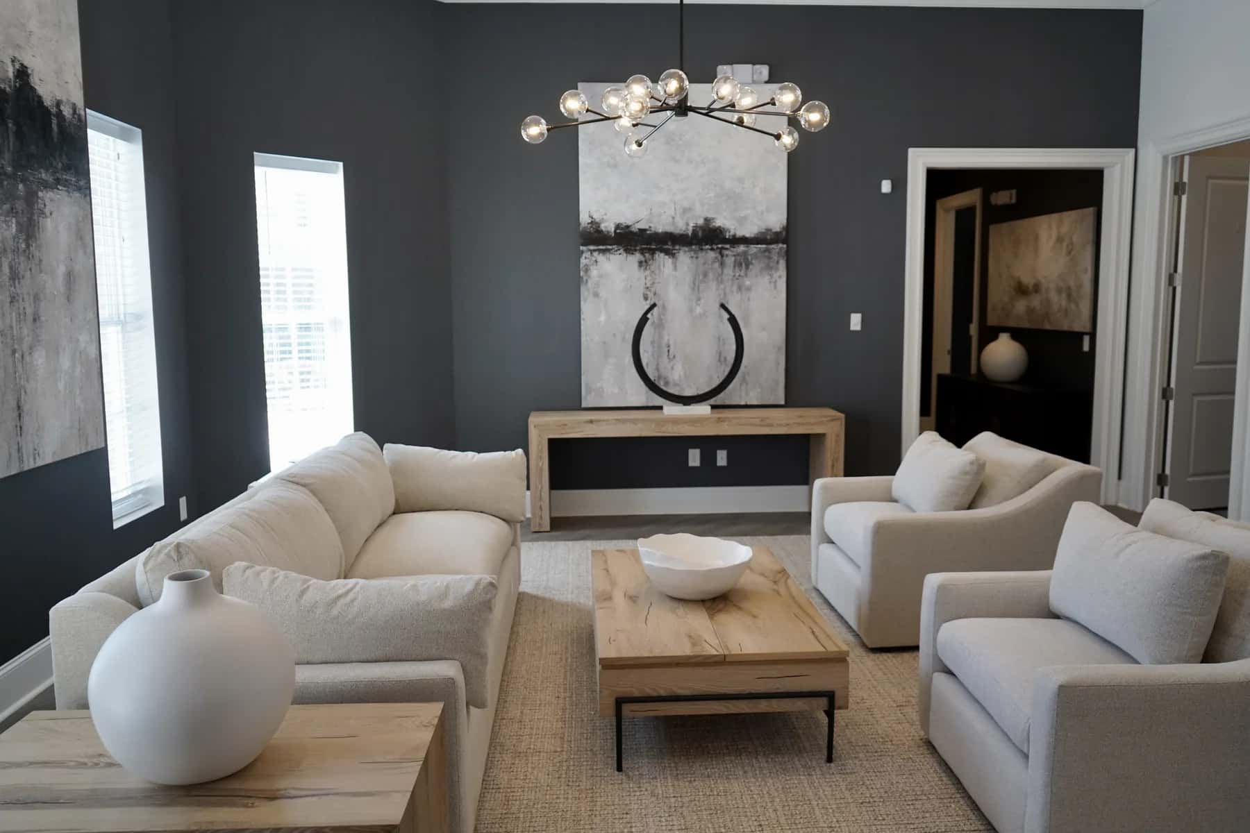 Dark accent wall with chandelier in a Charlotte living room