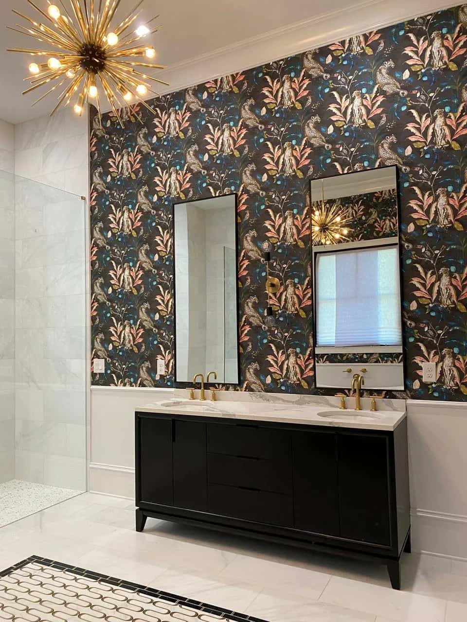 Leopard and foliage wallpaper above a black double vanity in a master bathroom
