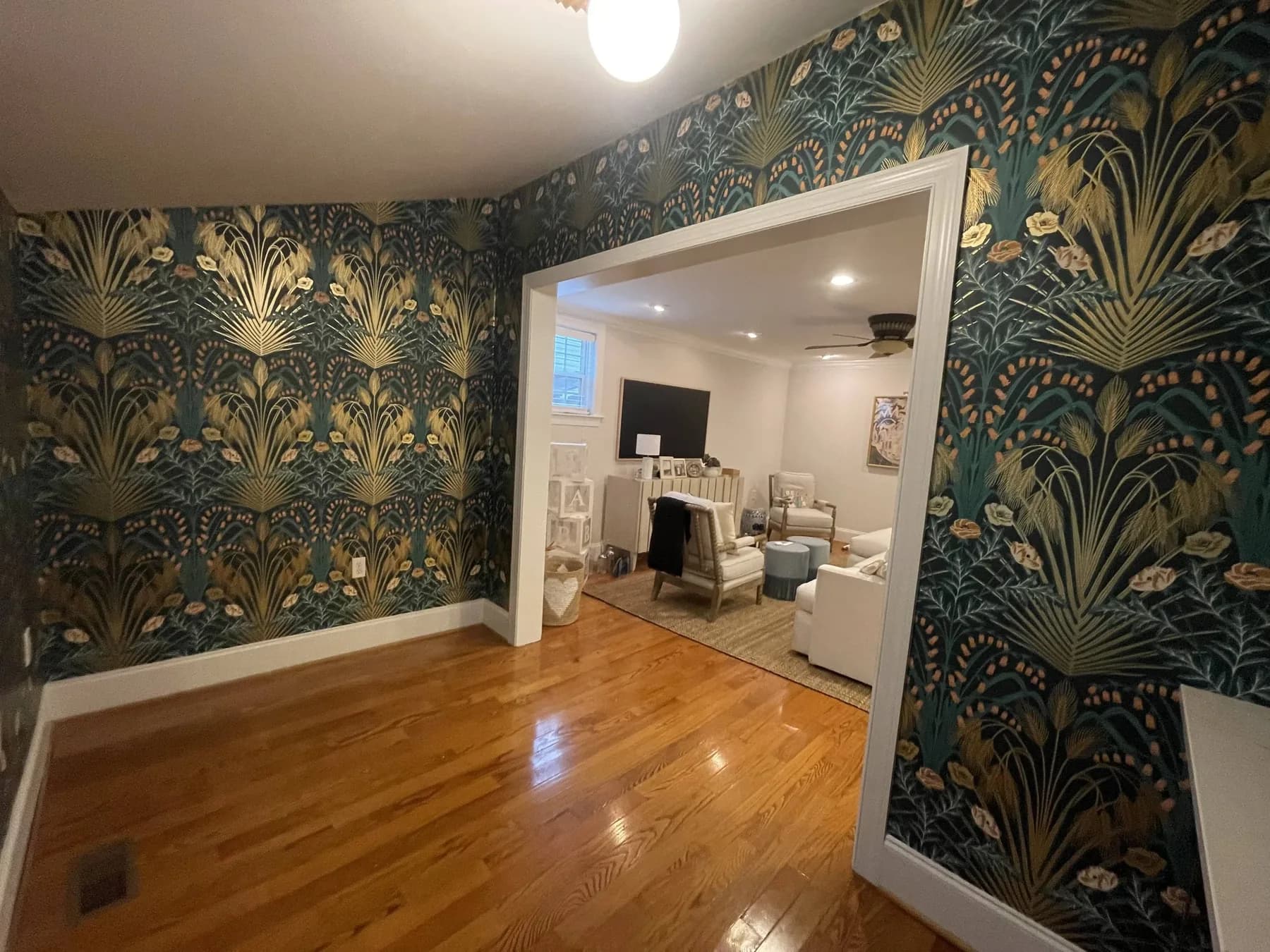 Green Morris-style peacock wallpaper in a Charlotte hallway